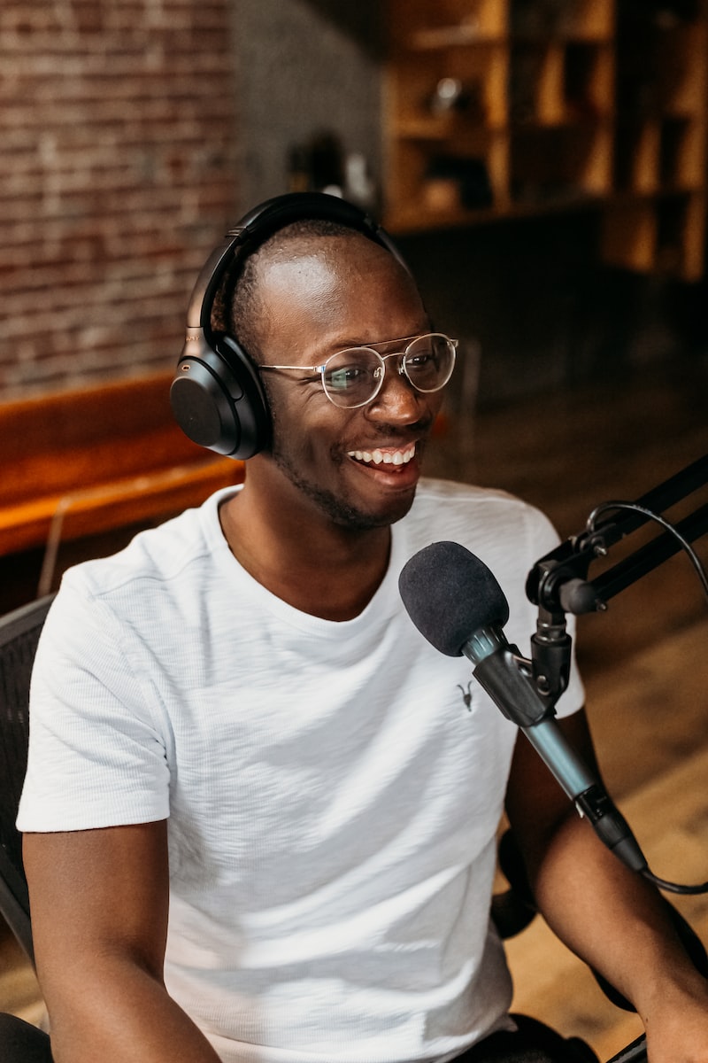 Revolt Studios, African American man in glasses podcasting